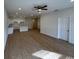 Spacious living room with ceiling fan that opens to a modern kitchen at 950 20Th St, Orlando, FL 32805