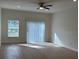 Spacious living room with a view to sliding glass door and a large window at 950 20Th St, Orlando, FL 32805