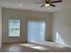 Large living room with a view to the sliding glass door and large window at 950 20Th St, Orlando, FL 32805