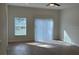 Large living room with a view to the sliding glass door and large window at 950 20Th St, Orlando, FL 32805