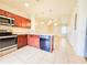 Modern kitchen featuring granite countertops and stainless steel appliances at 1132 Chelsea Dr, Davenport, FL 33897