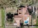 A top-down aerial shot showcases the layout of the property, including the pool, patio, and lush greenery at 1031 Kings Hwy, Kissimmee, FL 34744