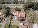 Spacious property boasts a large lot, private pool, and mature trees, offering a serene retreat at 1031 Kings Hwy, Kissimmee, FL 34744