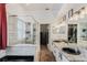 Elegant bathroom featuring a glass shower, dual sinks, and granite countertops at 1031 Kings Hwy, Kissimmee, FL 34744