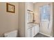 Bathroom with double vanity, granite countertop, and a framed mirror at 1031 Kings Hwy, Kissimmee, FL 34744
