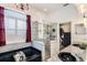 Luxurious bathroom with a soaking tub, glass shower, and dual sinks at 1031 Kings Hwy, Kissimmee, FL 34744