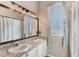 Bathroom featuring a double vanity and mirror at 1031 Kings Hwy, Kissimmee, FL 34744