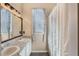 Bathroom featuring a double vanity and shower at 1031 Kings Hwy, Kissimmee, FL 34744