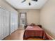 Bedroom with hardwood floors, closet, and a window at 1031 Kings Hwy, Kissimmee, FL 34744