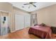 Bedroom features hardwood floors and a double closet at 1031 Kings Hwy, Kissimmee, FL 34744
