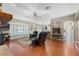 Comfortable living area featuring hardwood floors, comfortable seating, and an open floor plan at 1031 Kings Hwy, Kissimmee, FL 34744