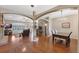 Open-concept living space with hardwood floors, stone fireplace, and abundant natural light at 1031 Kings Hwy, Kissimmee, FL 34744