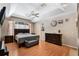 Serene main bedroom with tray ceiling, hardwood floors, and a large window at 1031 Kings Hwy, Kissimmee, FL 34744