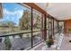 Inviting screened porch with a scenic backyard view and comfortable seating at 1031 Kings Hwy, Kissimmee, FL 34744