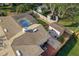 Aerial view of a home with a screened-in pool, shed, patio, and mature trees at 1232 Corbett Ln, Orlando, FL 32806