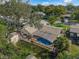 Aerial view of private backyard with screened pool, storage shed, and well-maintained landscaping at 1232 Corbett Ln, Orlando, FL 32806