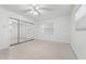 Bedroom featuring mirrored closet doors and a window at 1232 Corbett Ln, Orlando, FL 32806
