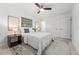 A cozy bedroom featuring a ceiling fan, bright white walls and comfortable decor at 1232 Corbett Ln, Orlando, FL 32806