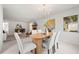 Dining room with contemporary table and seating, flowing into the spacious living area at 1232 Corbett Ln, Orlando, FL 32806