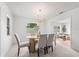 Bright dining area with a modern table, ample natural light, and a comfortable atmosphere at 1232 Corbett Ln, Orlando, FL 32806