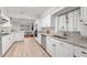 Bright kitchen features granite countertops, stainless appliances, and white cabinetry at 1232 Corbett Ln, Orlando, FL 32806