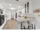 Beautiful kitchen with white cabinets, modern appliances, and breakfast bar with seating at 1232 Corbett Ln, Orlando, FL 32806