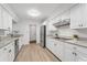 Well-lit kitchen offers stainless steel appliances, granite counters, and ample cabinet space at 1232 Corbett Ln, Orlando, FL 32806