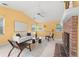 Comfortable living room with fireplace, modern seating, and large windows providing natural light at 1232 Corbett Ln, Orlando, FL 32806