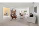 Spacious living room featuring a brick fireplace, neutral tones, and abundant natural light at 1232 Corbett Ln, Orlando, FL 32806