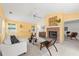 Spacious living room features a brick fireplace, shelving, and large windows at 1232 Corbett Ln, Orlando, FL 32806