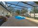 Private in-ground pool within a screened enclosure, complemented by a spacious patio and outdoor seating at 1232 Corbett Ln, Orlando, FL 32806