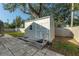 The backyard has a functional storage shed for gardening tools and equipment, keeping everything organized at 1232 Corbett Ln, Orlando, FL 32806