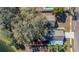 Aerial view of home with lush trees, fenced yard, and in-ground pool at 1320 Corte Nueva, Winter Springs, FL 32708