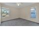 Bedroom featuring neutral carpeting and natural light from two large windows at 1320 Corte Nueva, Winter Springs, FL 32708