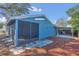 Rear view of home with covered patio and space for parking at 1320 Corte Nueva, Winter Springs, FL 32708