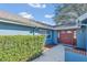 Inviting home entrance showcasing a double-door entry and well-maintained shrubbery at 1320 Corte Nueva, Winter Springs, FL 32708