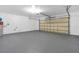 Spacious garage with sealed flooring and a garage door at 1320 Corte Nueva, Winter Springs, FL 32708