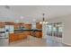 Bright kitchen with a center island, stainless appliances, and sliding door access to outdoor views at 1320 Corte Nueva, Winter Springs, FL 32708