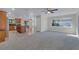 Large living room features an open layout with a direct view into the kitchen and ample natural light at 1320 Corte Nueva, Winter Springs, FL 32708