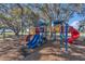 Community playground featuring multiple slides and climbing structures for ' enjoyment at 1320 Corte Nueva, Winter Springs, FL 32708