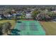 Aerial view of well-maintained tennis courts within a lush green community setting at 1320 Corte Nueva, Winter Springs, FL 32708