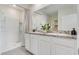 Bright bathroom with granite counters, double sinks, shower and tub, and ample storage at 1344 Hanoverian Dr, Lake Alfred, FL 33850