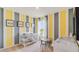 bedroom features a crib, accent wall, and plenty of natural light at 1344 Hanoverian Dr, Lake Alfred, FL 33850