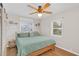 Comfortable bedroom with a ceiling fan and bright natural light at 157 Birchwood Dr, Maitland, FL 32751