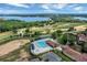 Resort-style pool, clubhouse, and golf course with beautiful lake views at 16112 Vetta Dr, Montverde, FL 34756