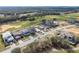 Aerial view of a luxury golf community featuring beautifully landscaped homes and lush green fairways at 16112 Vetta Dr, Montverde, FL 34756