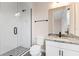 Modern bathroom featuring a glass shower, granite countertop, and sleek black fixtures at 16112 Vetta Dr, Montverde, FL 34756