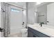 Modern bathroom featuring a shower-tub combo and a sleek vanity with matte black fixtures at 16112 Vetta Dr, Montverde, FL 34756