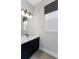 This bathroom features a sleek vanity with a modern sink and stylish lighting fixture at 16112 Vetta Dr, Montverde, FL 34756