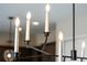 Elegant chandelier with candle-style bulbs and a sleek black frame adds a touch of sophistication at 16112 Vetta Dr, Montverde, FL 34756